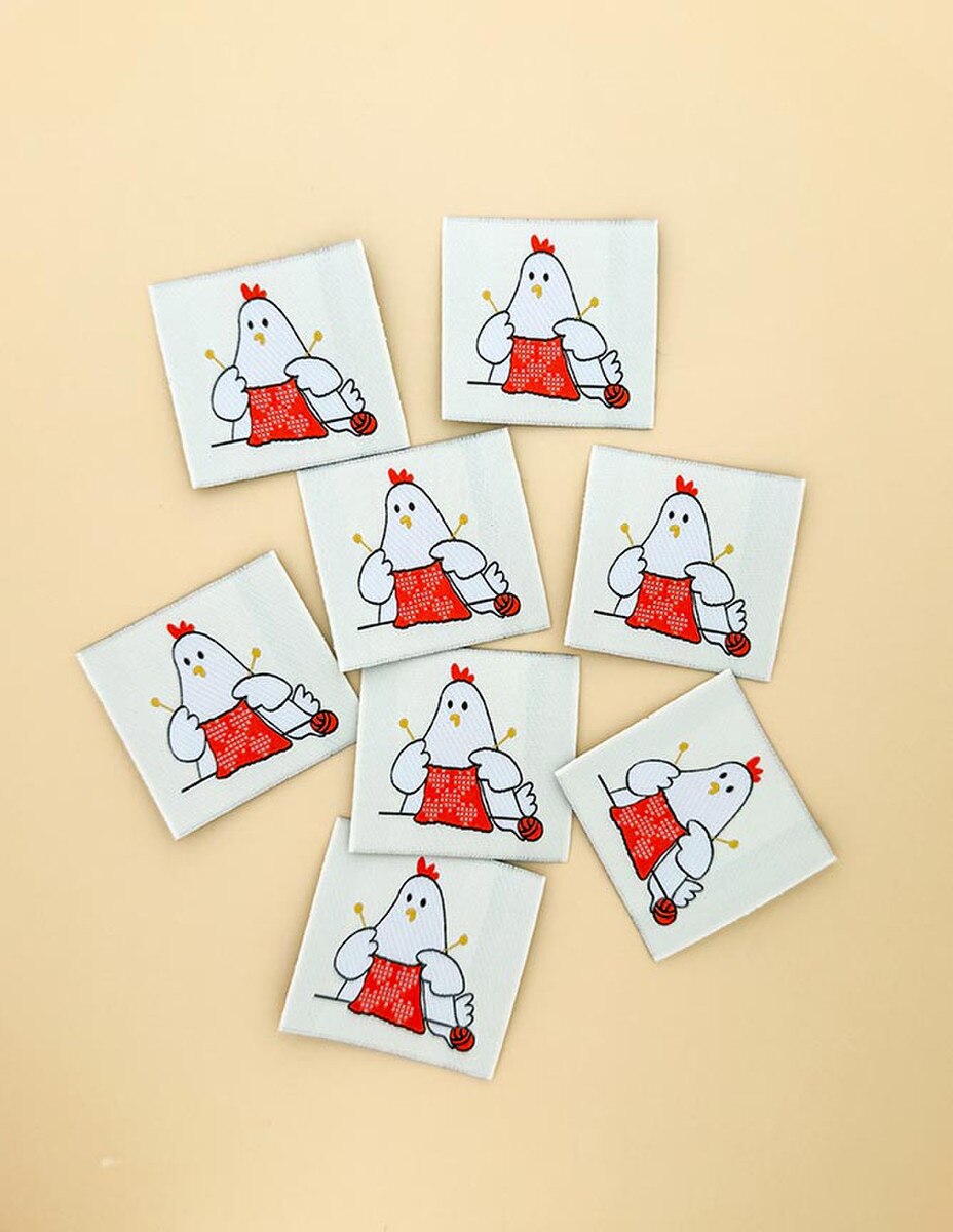 Set of six tags with cartoon chicken designs on a beige background
