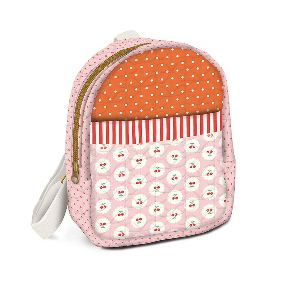 Small backpack with polka dot and patterned design on a white background
