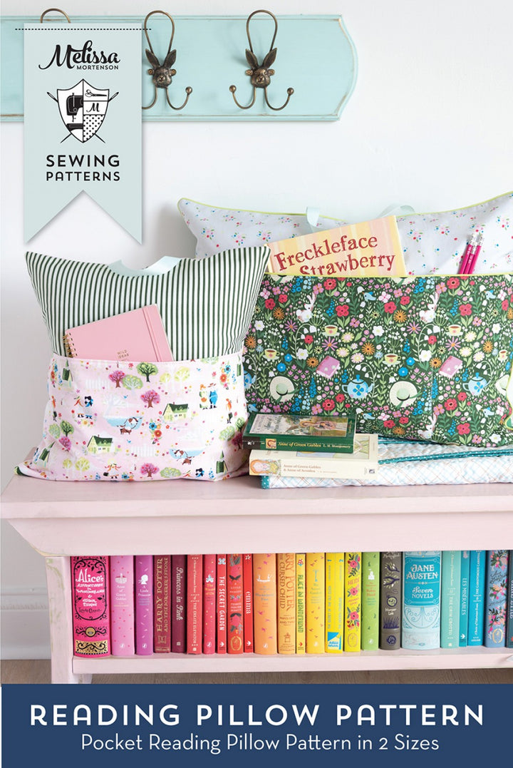 Sewing pattern books and materials on a shelf with sewing patterns book.