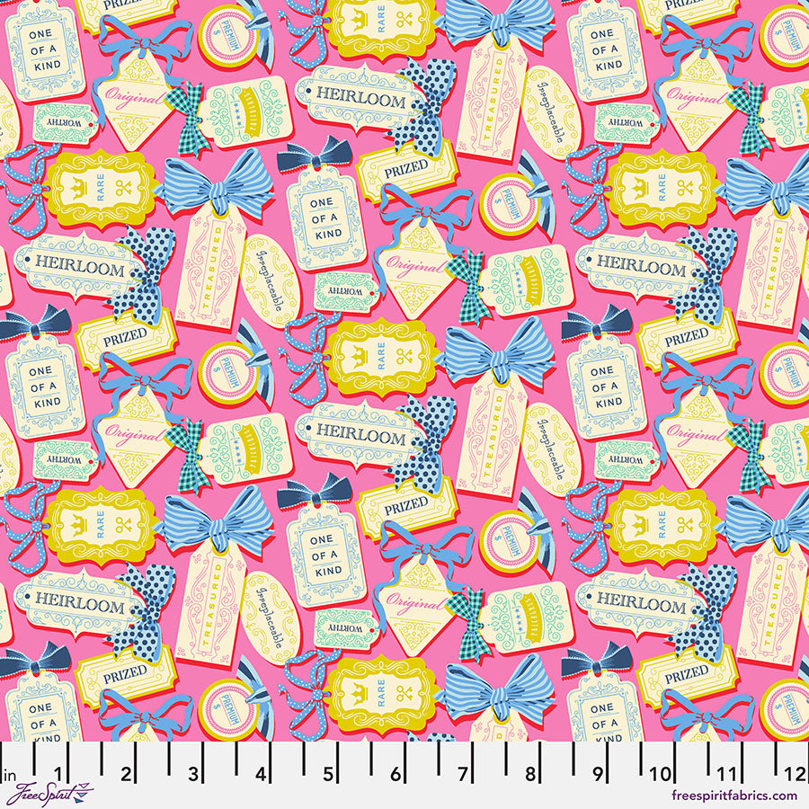 Fabric with decorative tags and bows on a pink background