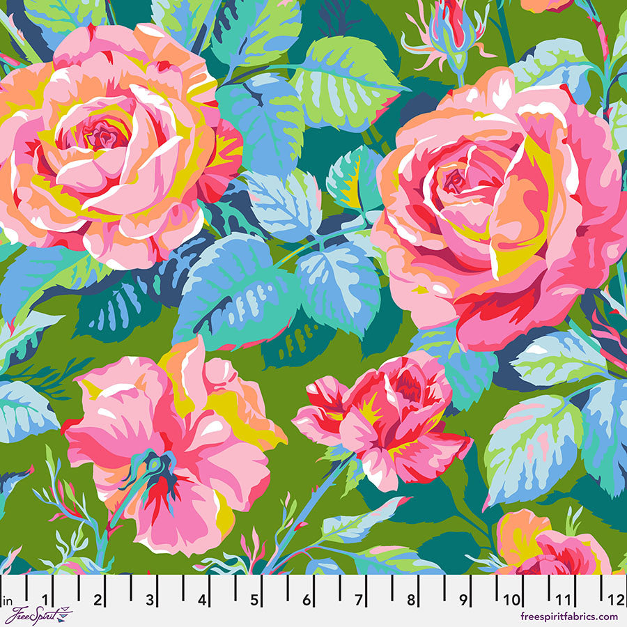 Colorful floral pattern with pink and blue flowers on a green background, featuring a ruler at the bottom.