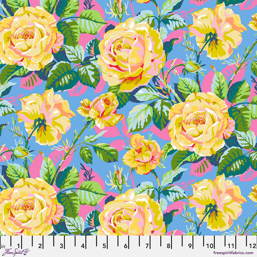 Colorful floral pattern with yellow roses on a blue background, featuring a ruler at the bottom.