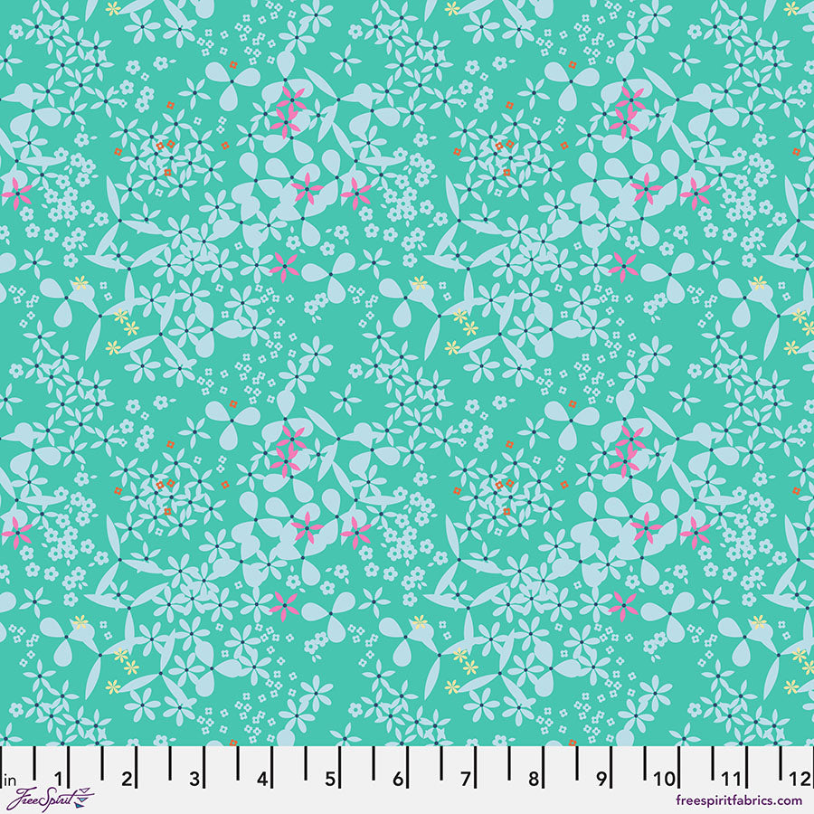 Floral pattern fabric swatch on a teal background with a ruler at the bottom.