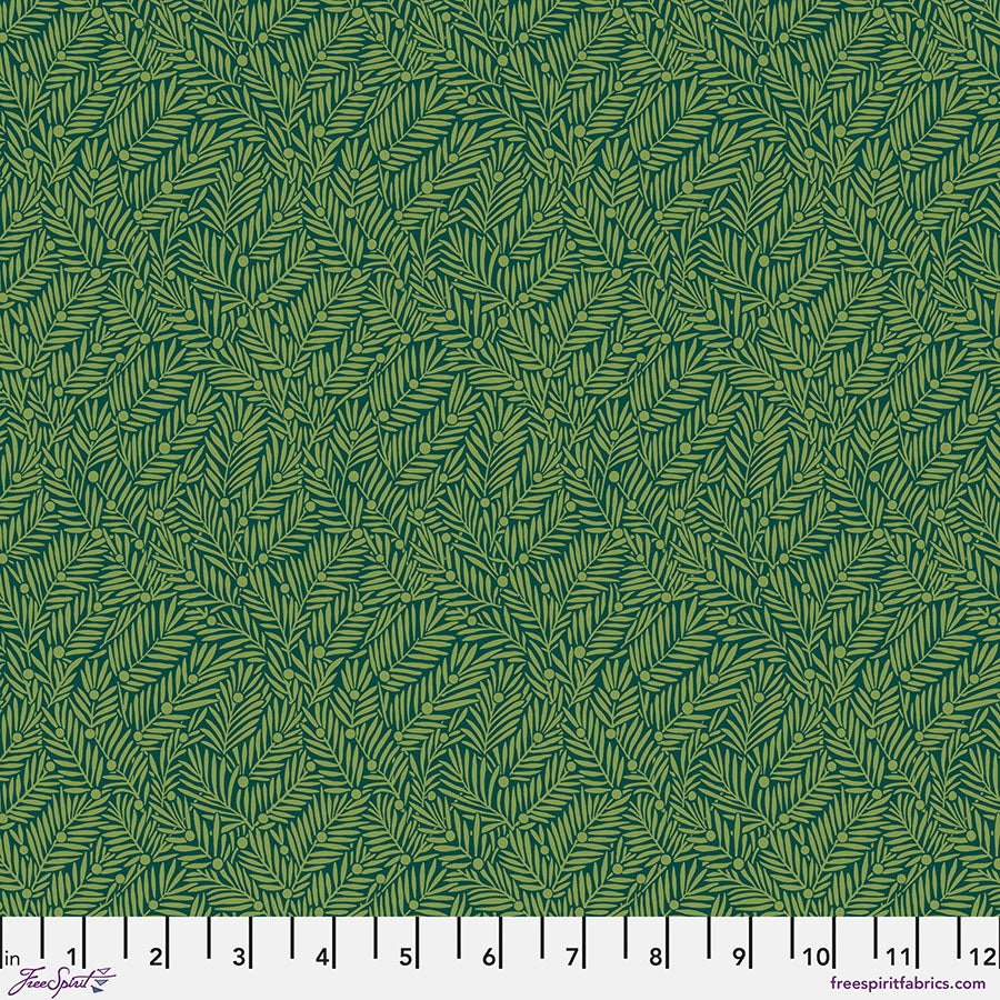 Green fabric with leaf pattern and ruler at the bottom
