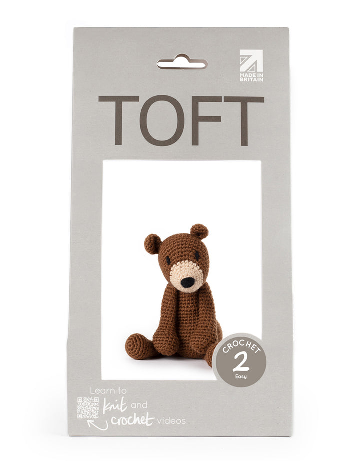 Toft Penelope the Bear Kit. The animal is a brown crocheted stuffed bear.