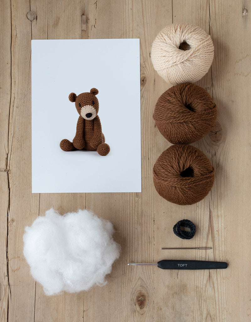 This kit includes yarn, stuffing, needle, and crochet hook