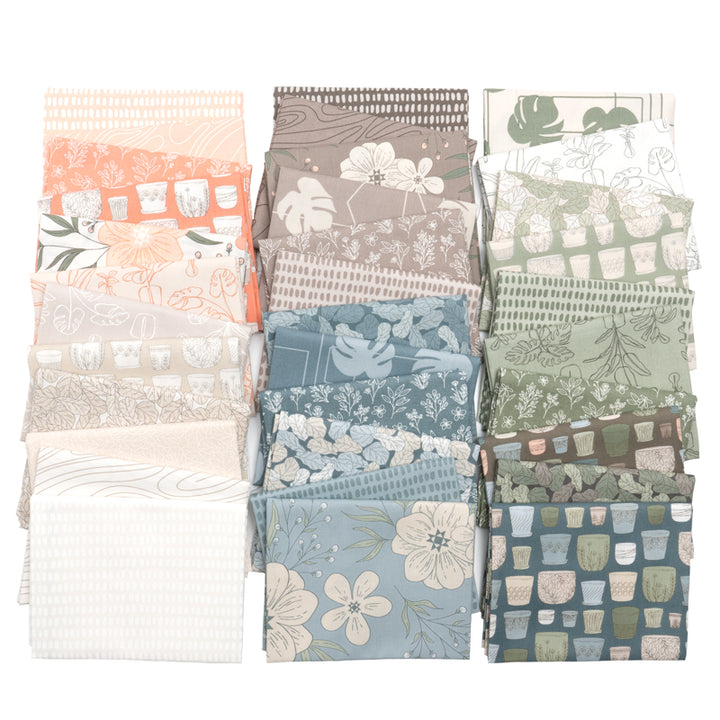 Collection of folded fabric swatches with various patterns on a white background