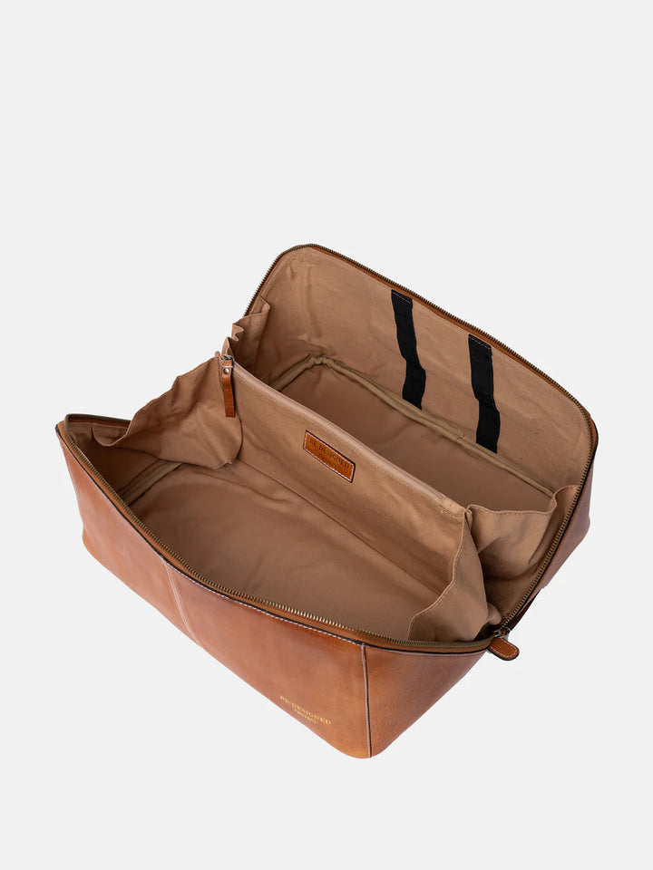 Brown leather knitting bag with open top on a white background
