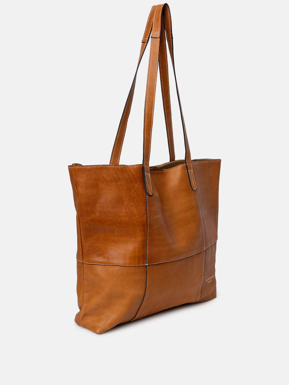 Brown leather tote bag on a white background
