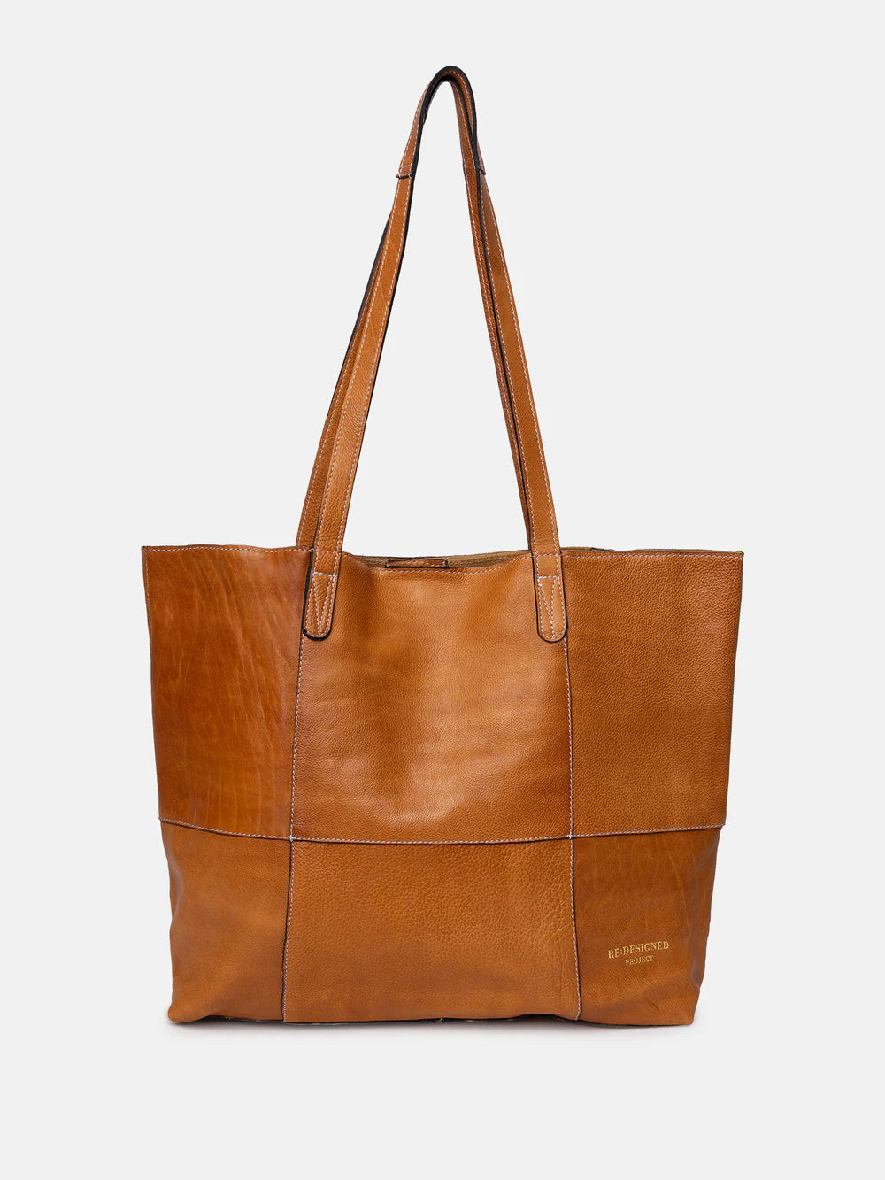 Brown leather tote bag on a light gray background