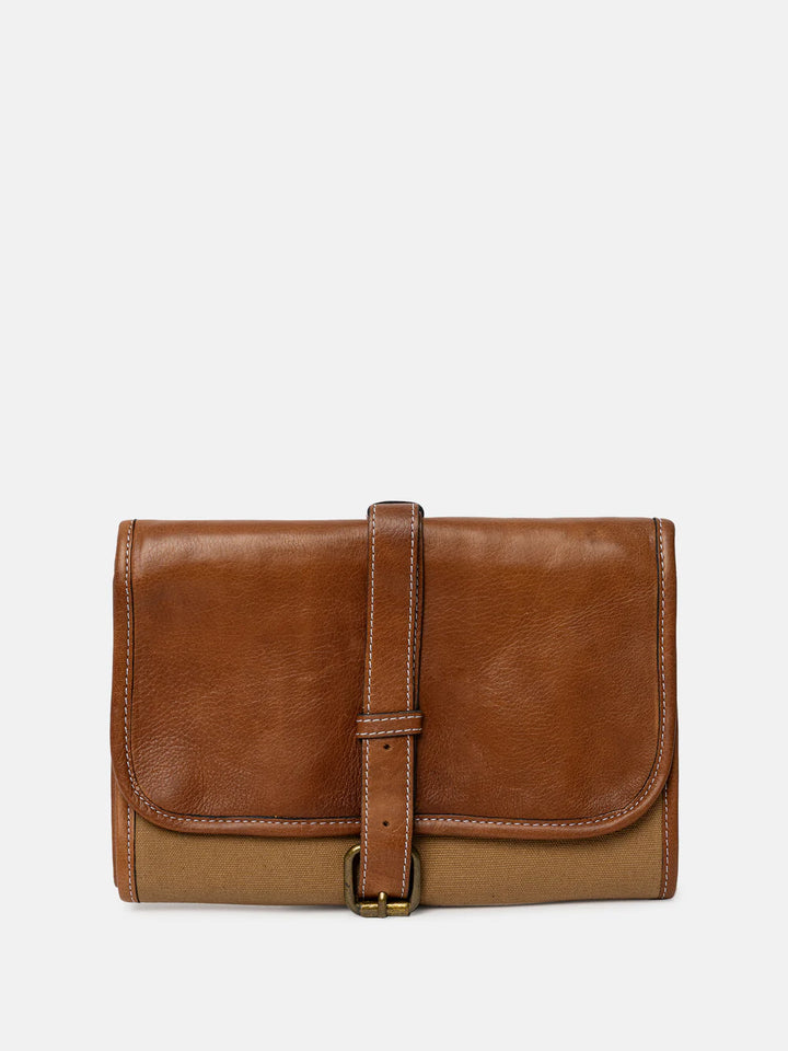 Brown leather needle case on a light gray background