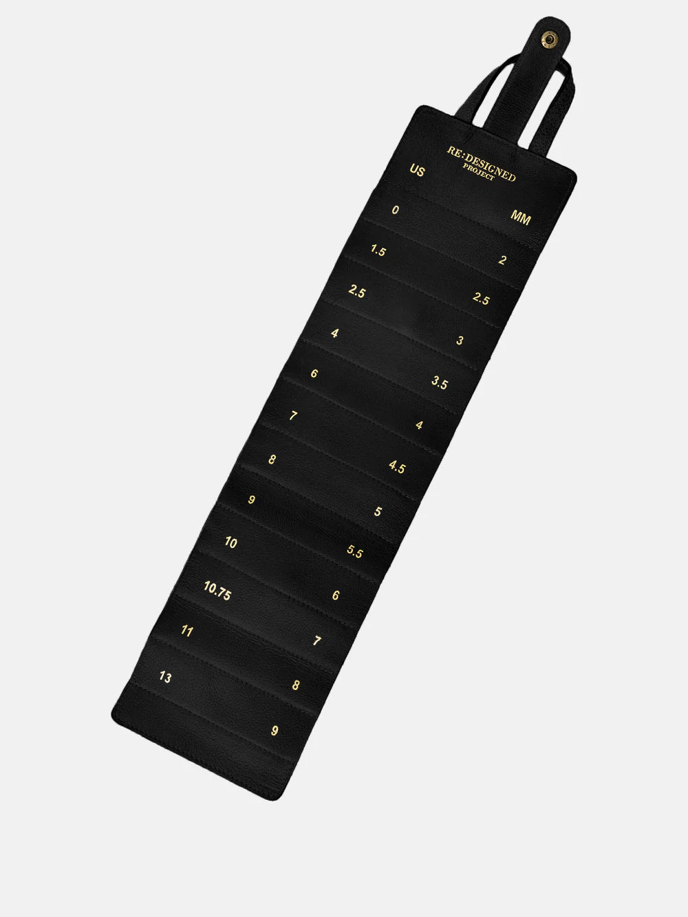 Black measuring tape with gold numbers on a white background