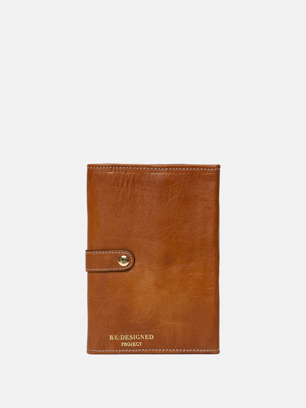 Brown leather needle case with gold buckle on a white background