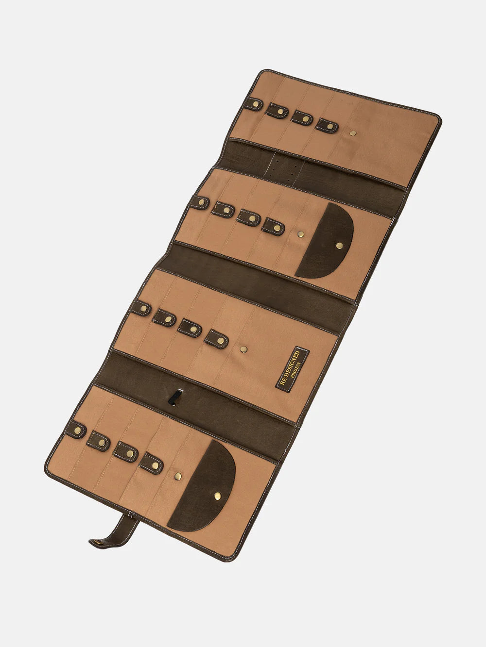 Foldable leather needle case with multiple compartments on a white background