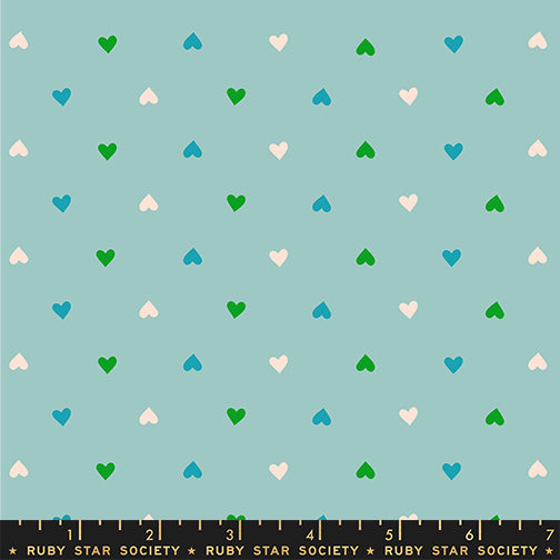 Pattern of small colorful hearts on a light blue background with Ruby Star Society label at the bottom.