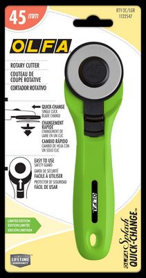 OLFA rotary cutter in the package with branding and product details.