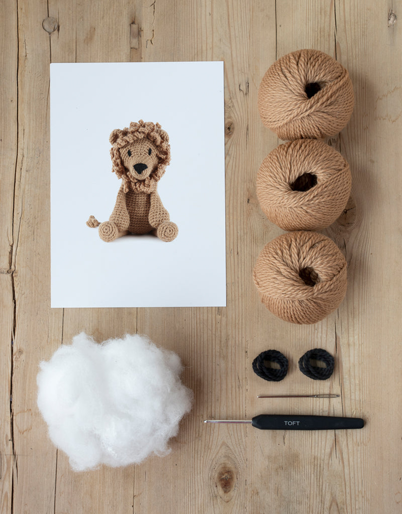 Rufus the Lion Kit includes yarn, stuffing, needle, and crochet hook