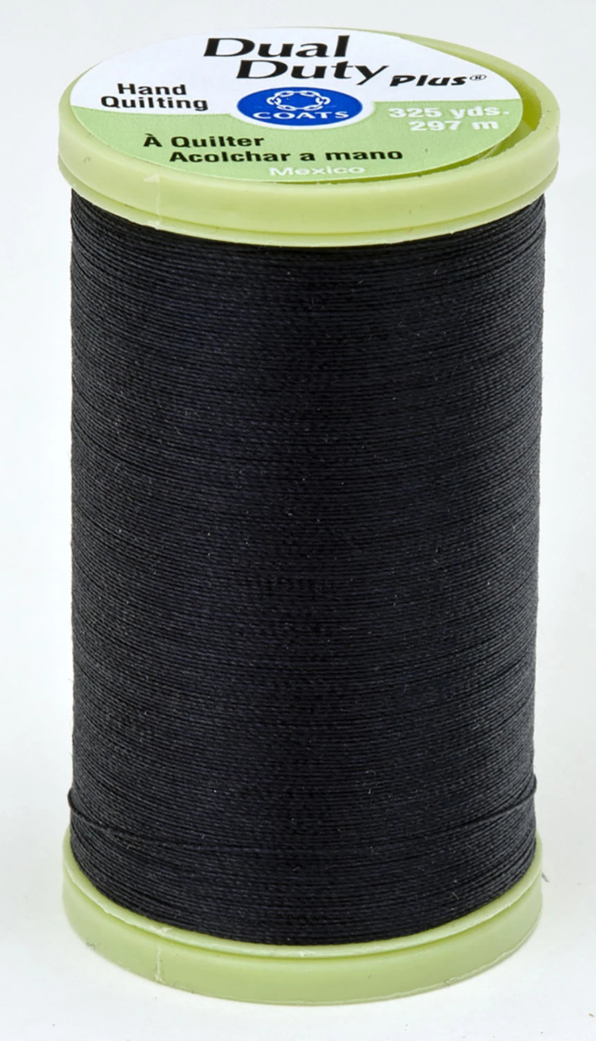 Spool of black thread with a green label on a white background