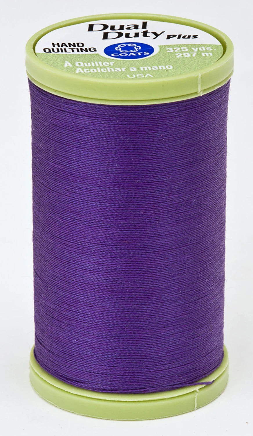 Spool of purple thread with a green spool cap on a white background