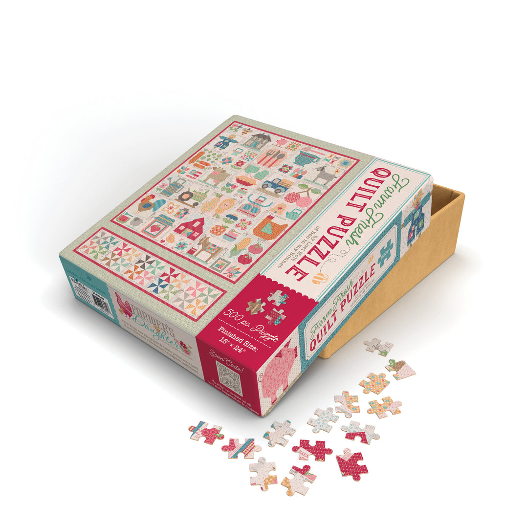 Quilt-themed puzzle box with scattered pieces on a white background