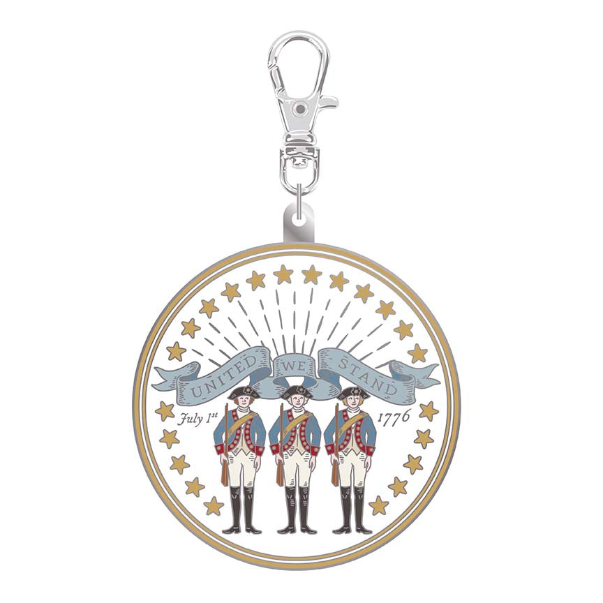 Keychain with circular design featuring three figures and a banner on a white background