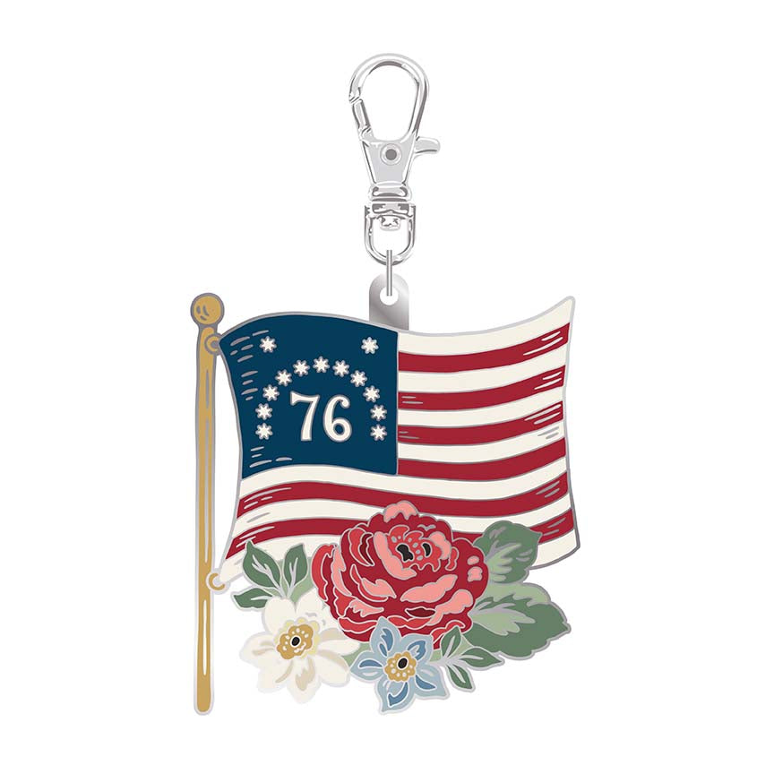 Keychain with American flag design featuring the number 76, flowers, and a clasp on a white background.