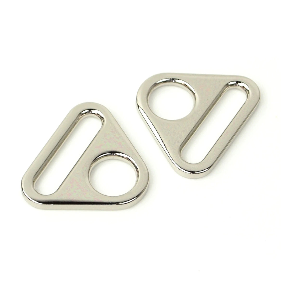 Two metallic triangle-shaped rings on a white background
