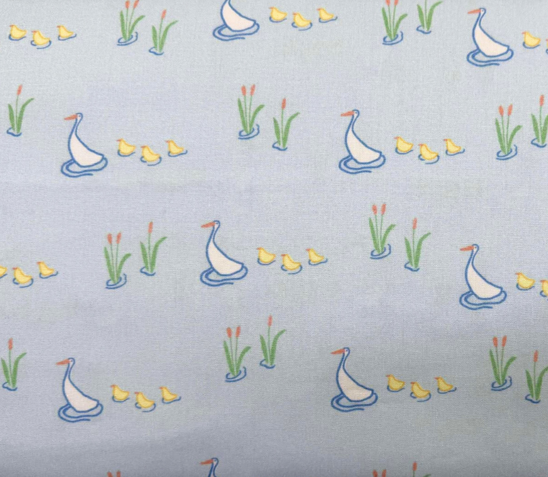 Blue background with mama ducks and baby ducks following behind