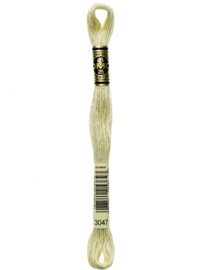 Beige embroidery floss on a white background