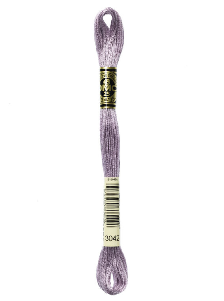 Skein of DMC purple embroidery floss on a white background