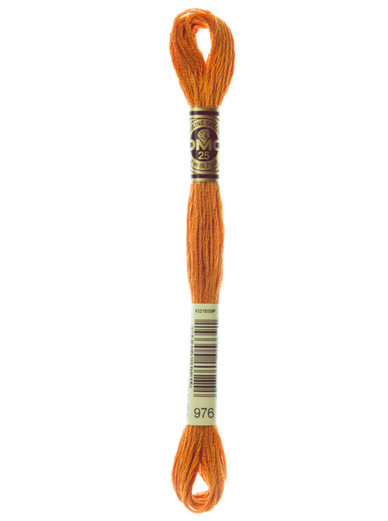 Orange embroidery floss on a white background