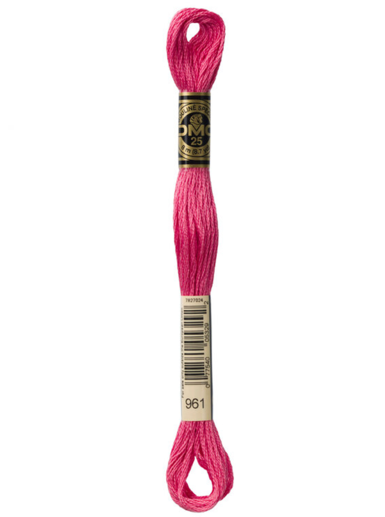 Pink embroidery floss with DMC label on a white background