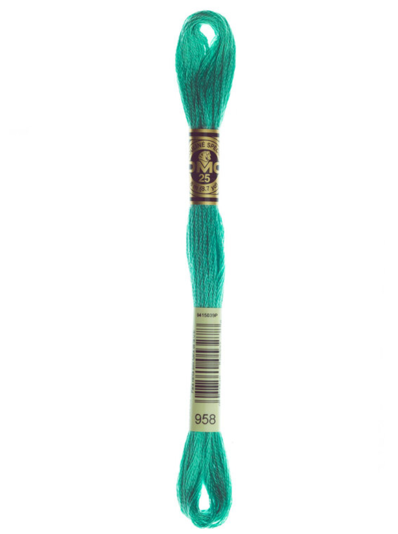 Turquoise embroidery floss skein with a brand label on a white background