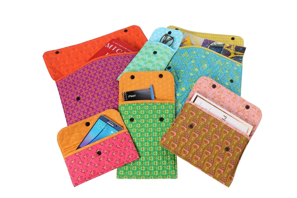 Colorful patterned pouches on a white background