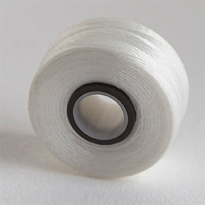 white thread prewound on a bobbin