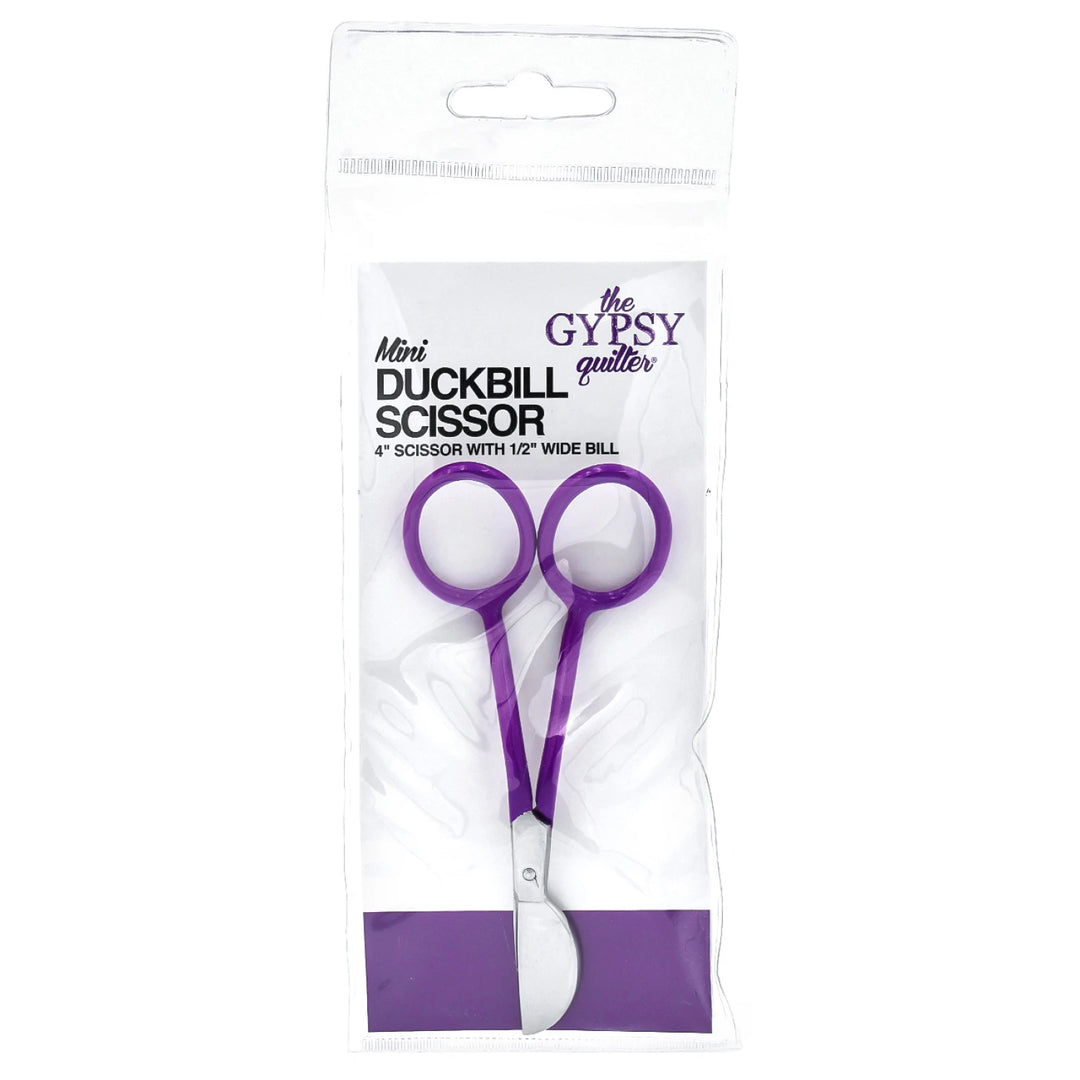 Purple duckbill scissors in packaging with 'The Gypsy Quilter' branding on a white background.