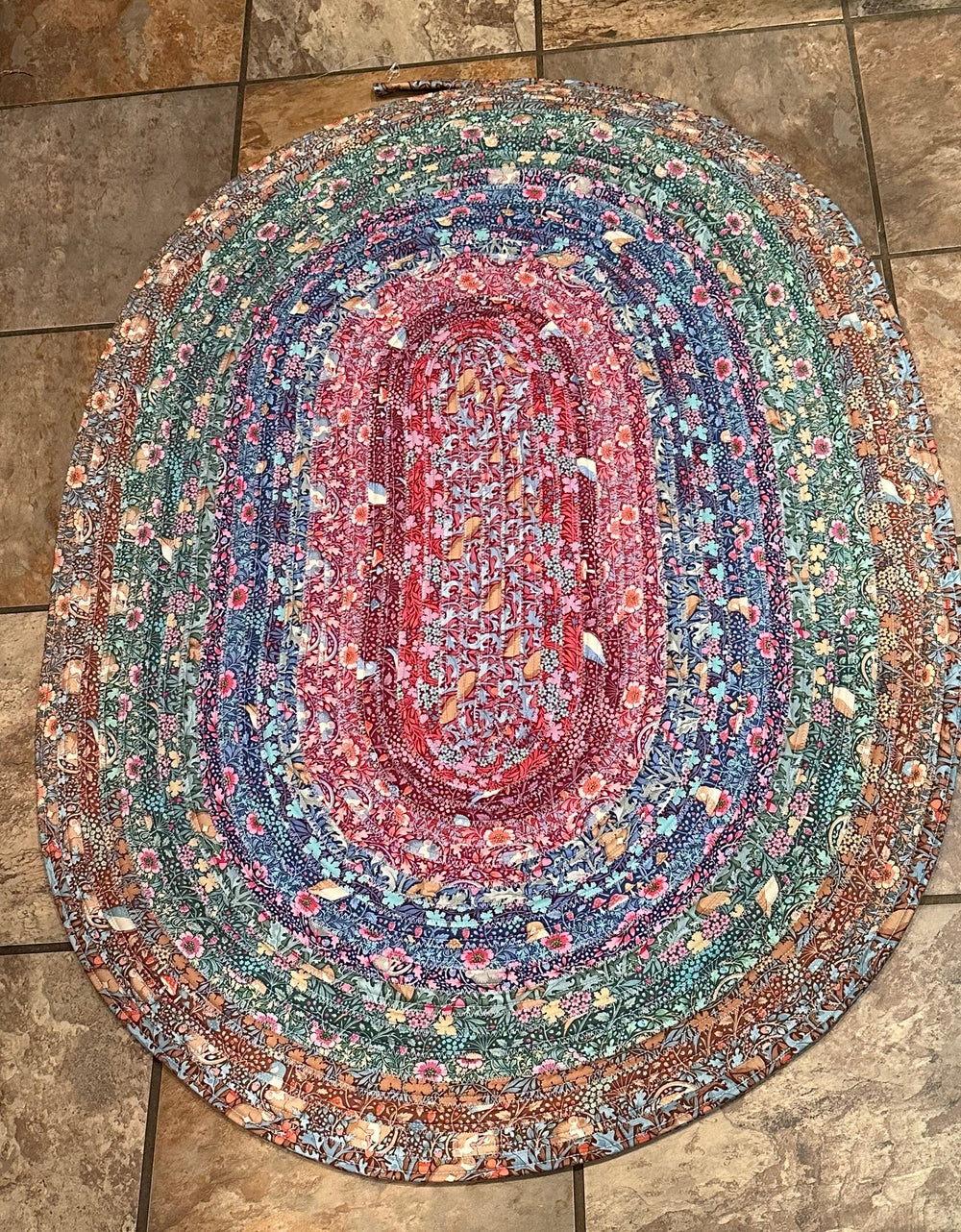 multi colored jelly roll rub on a ceramic tile floor