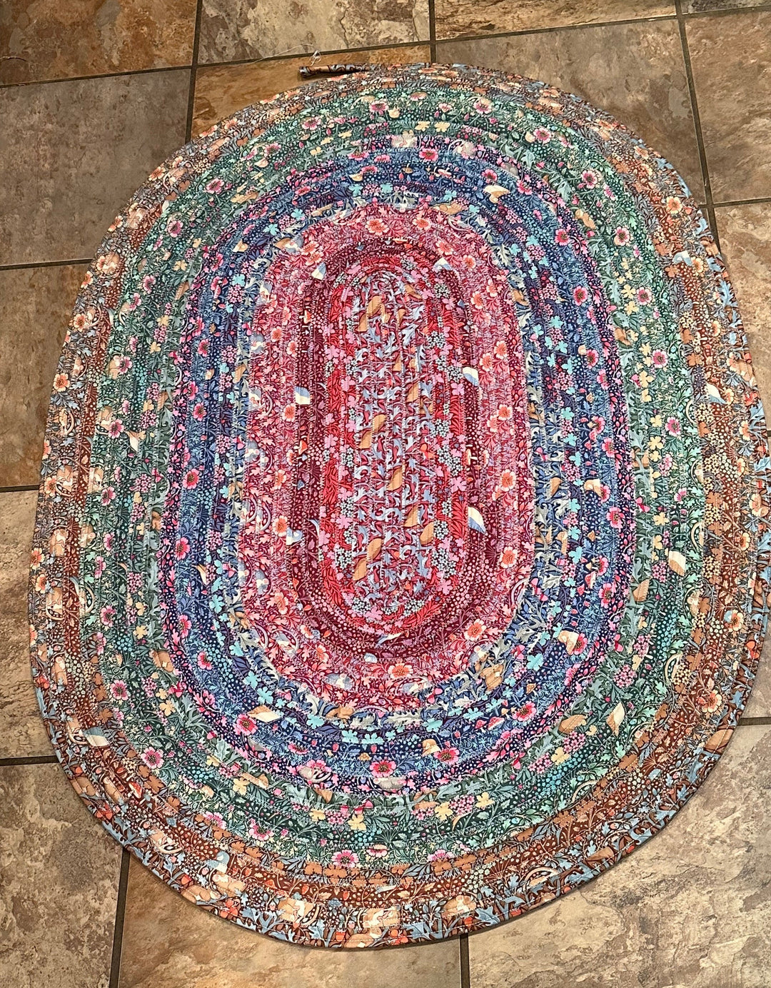 multi colored jelly roll rub on a ceramic tile floor