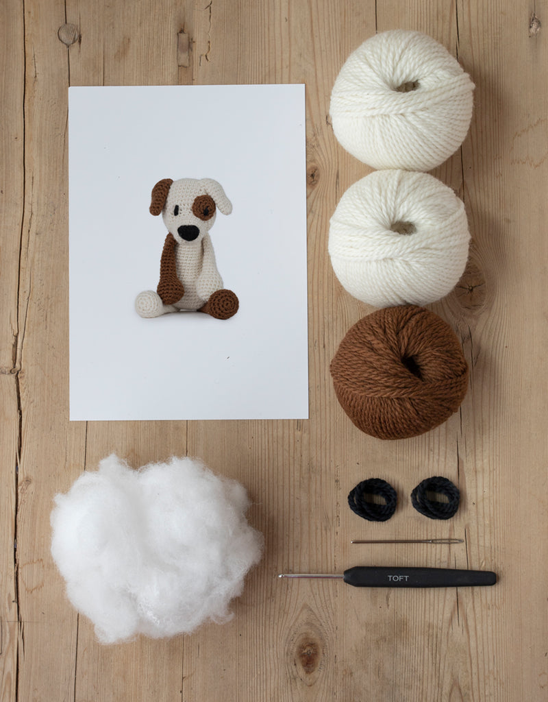Tucker the Jack Russel Kit includes yarn, stuffing, needle, crochet hook