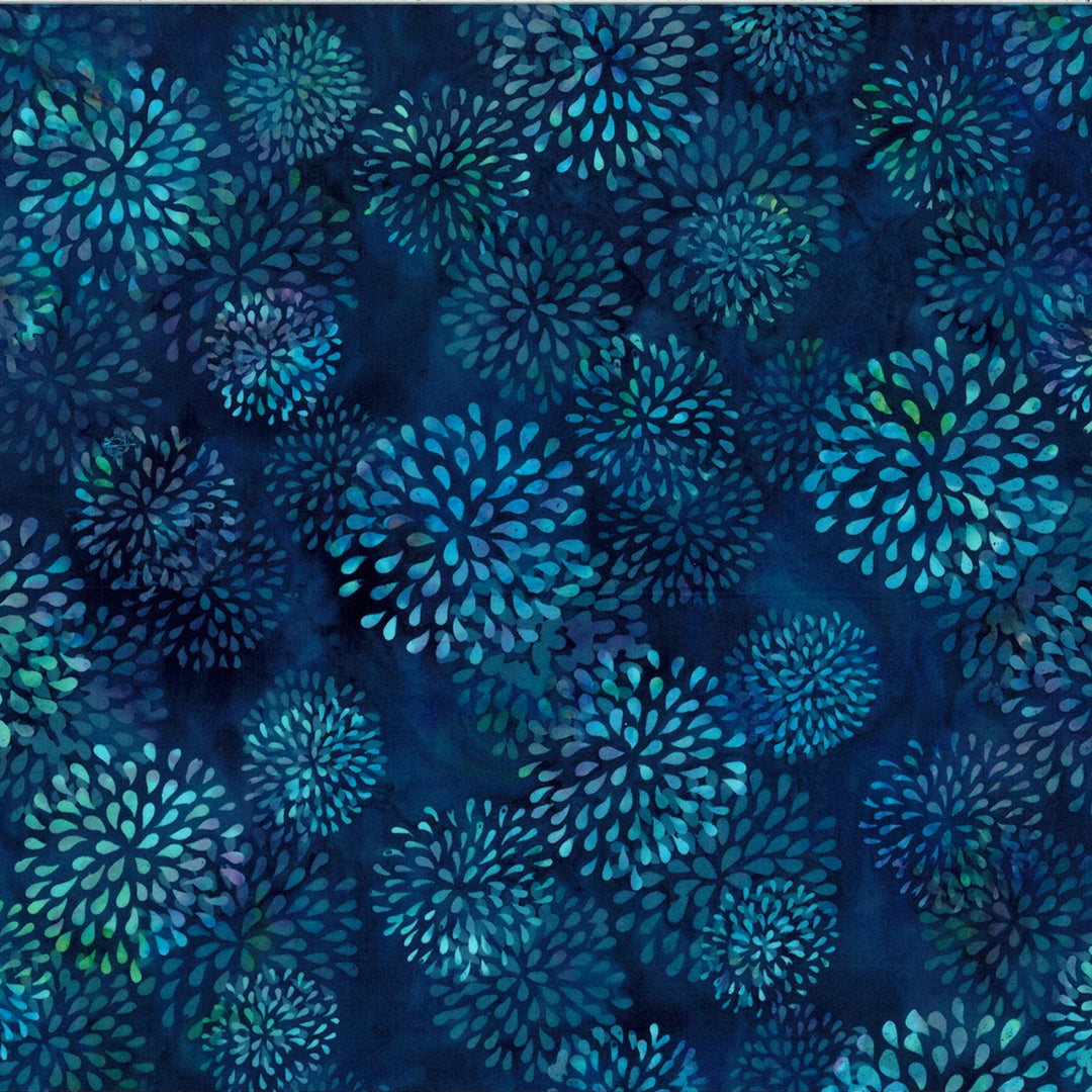 Pattern of blue floral shapes on a dark blue background