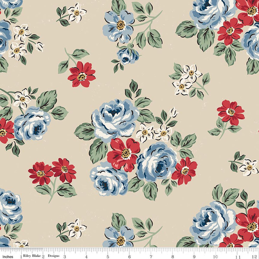 Floral fabric pattern with blue, red, and white flowers on a beige background.