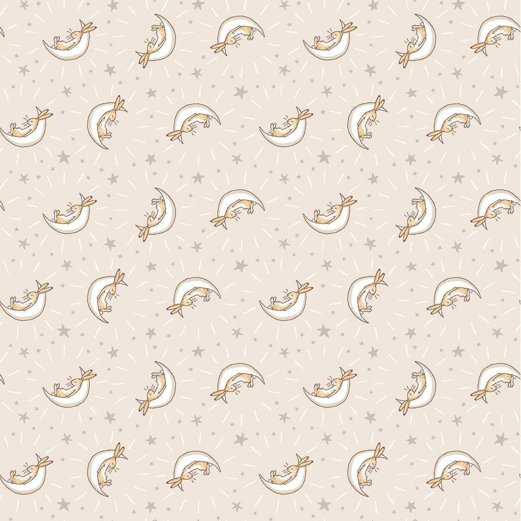 khaki fabric covered with white half moons and bunnies