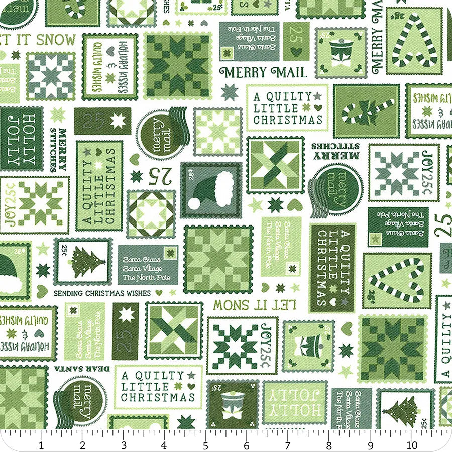 Green and white fabric with an assortment of Christmas stamps