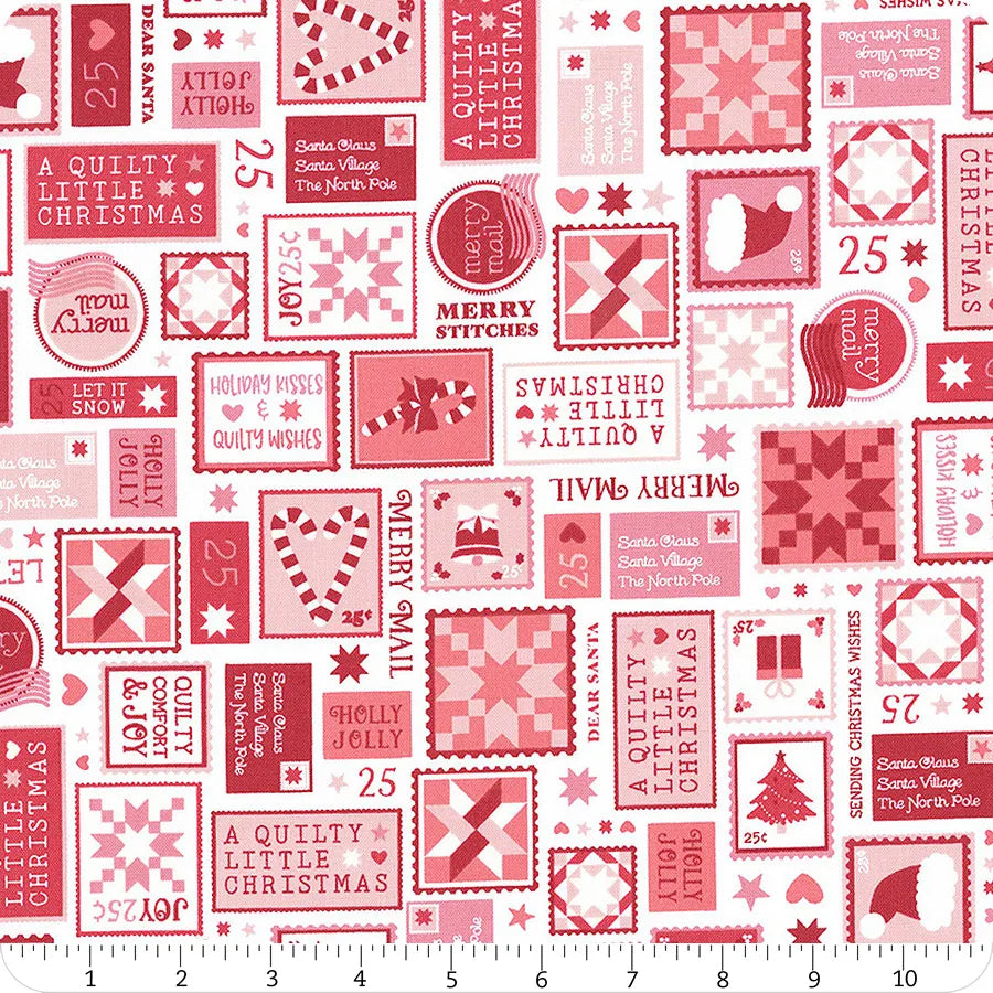 Red and white fabric with an assortment of Christmas stamps