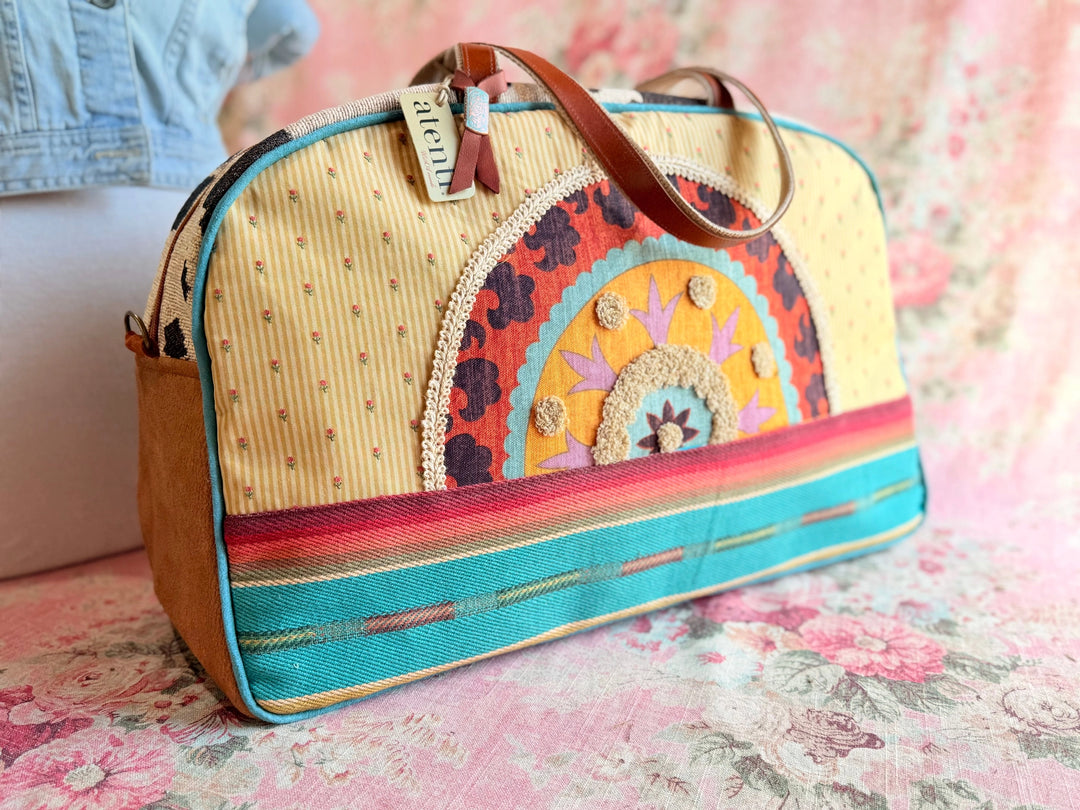 Colorful handbag with floral patterns on a floral surface