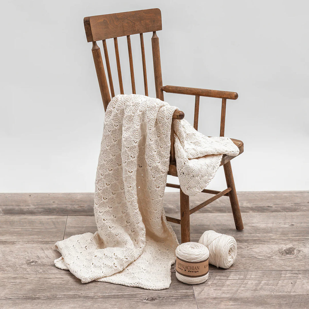 Baby Soft Organic Cotton Blanket draped on a chair as an example.