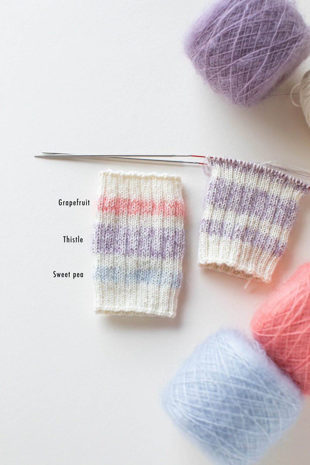Yarn sample of Grapefruit, Thistle, and Sweet Pea color ways