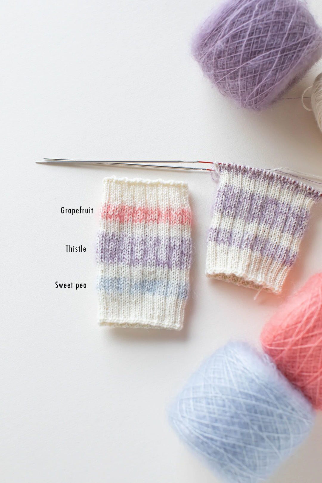 Yarn sample of Grapefruit, Thistle, and Sweet Pea color ways