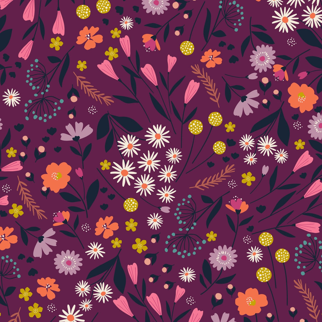 fabric with a purple background and an assortment of flowers