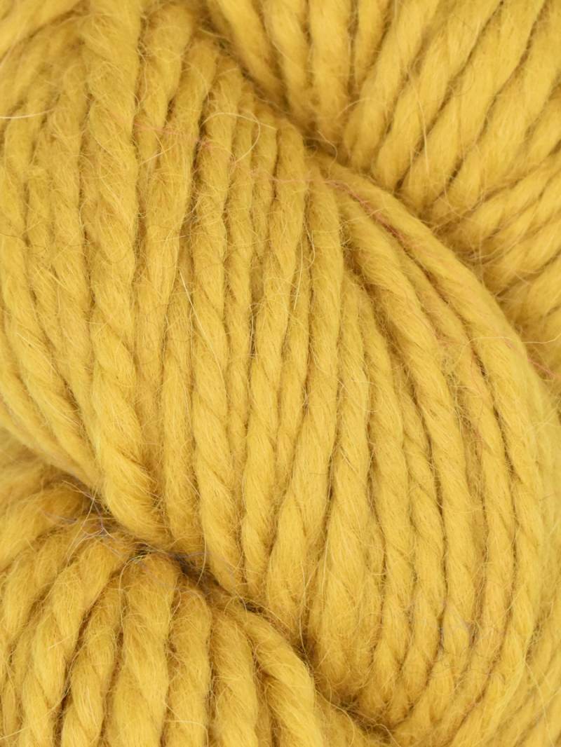 Close-up of yellow yarn with a focus on texture and color.